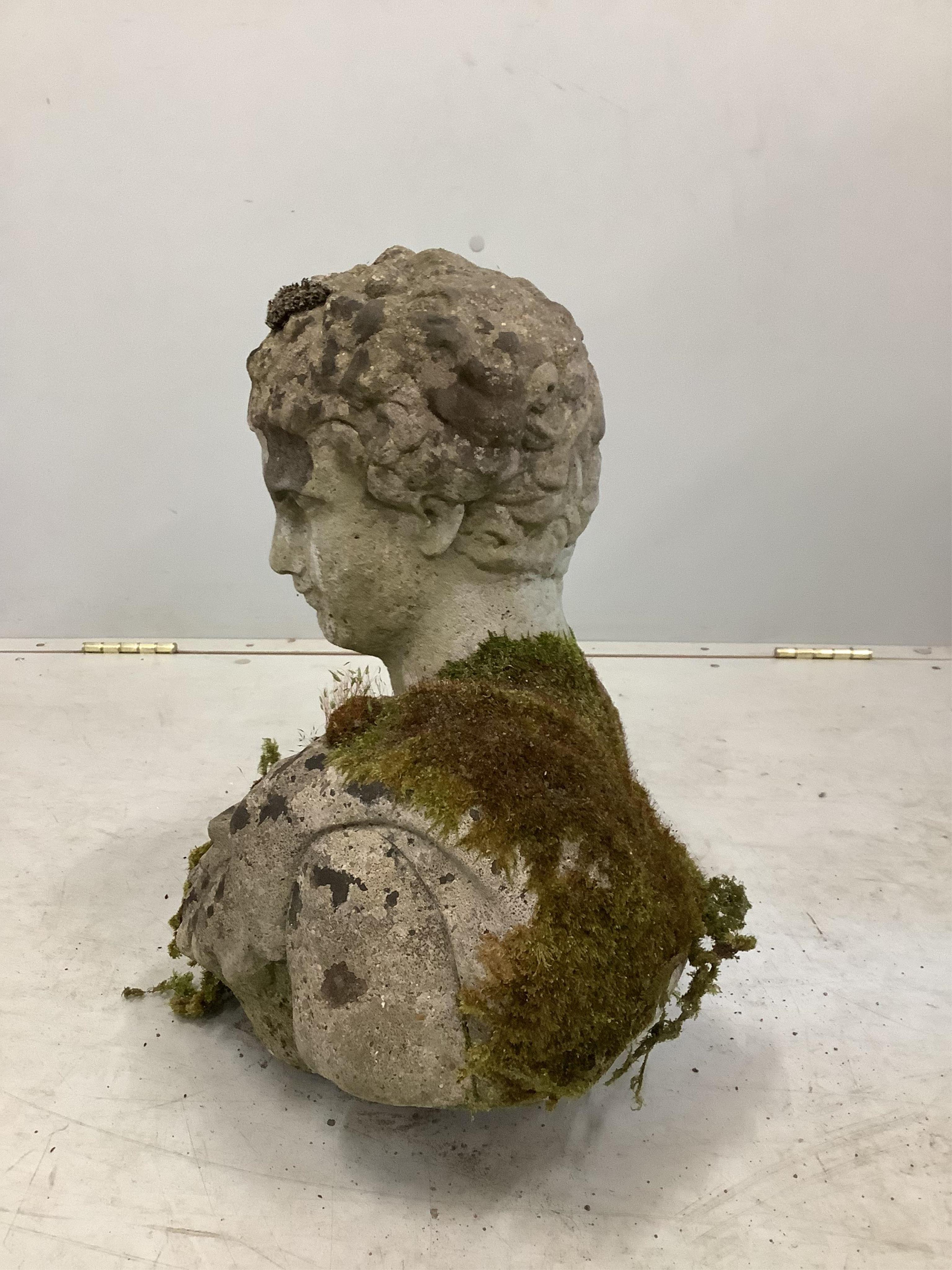 A weathered reconstituted stone garden ornament, height 42cm. Condition - fair